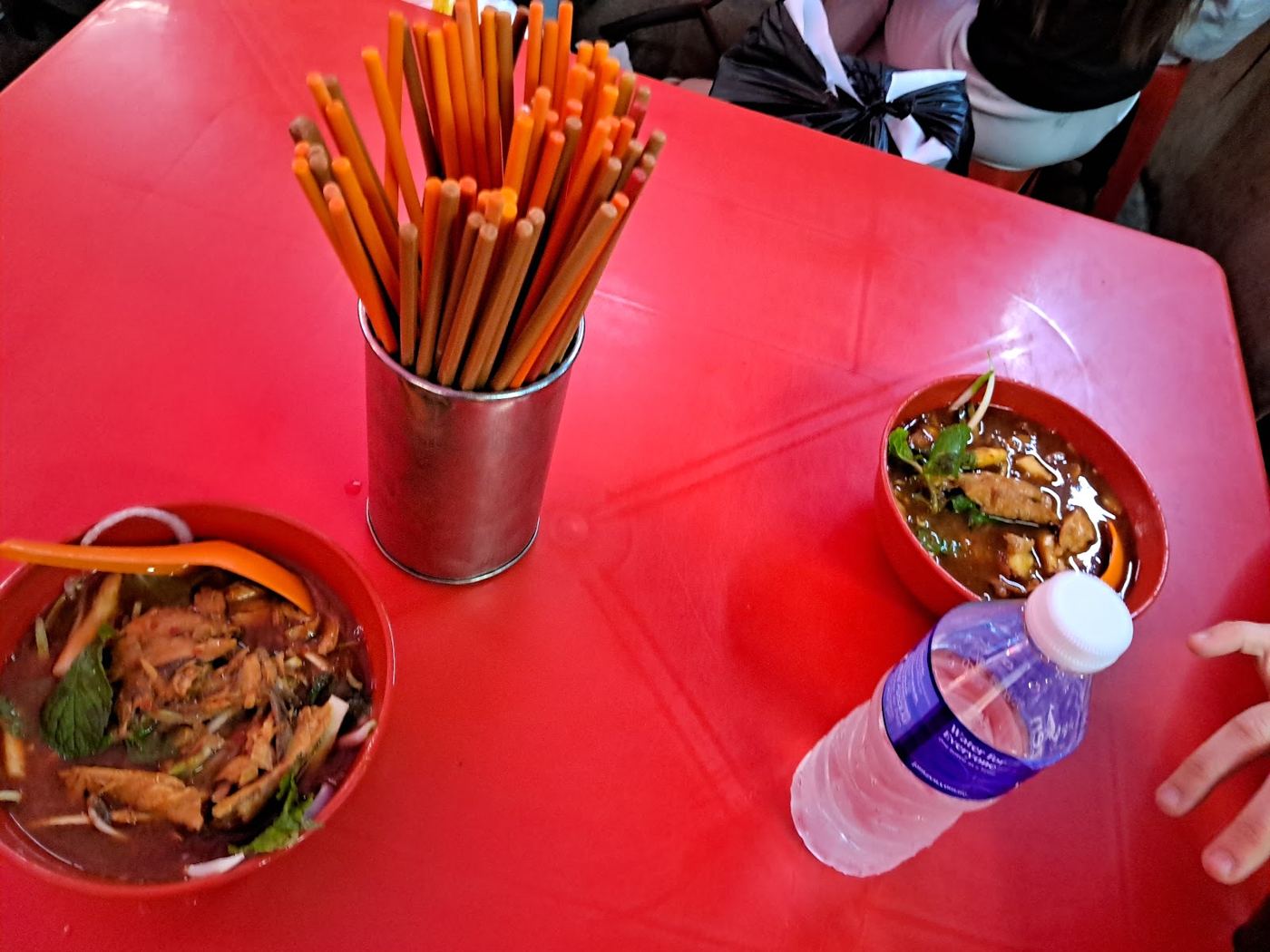 Red table with orange chopsticks